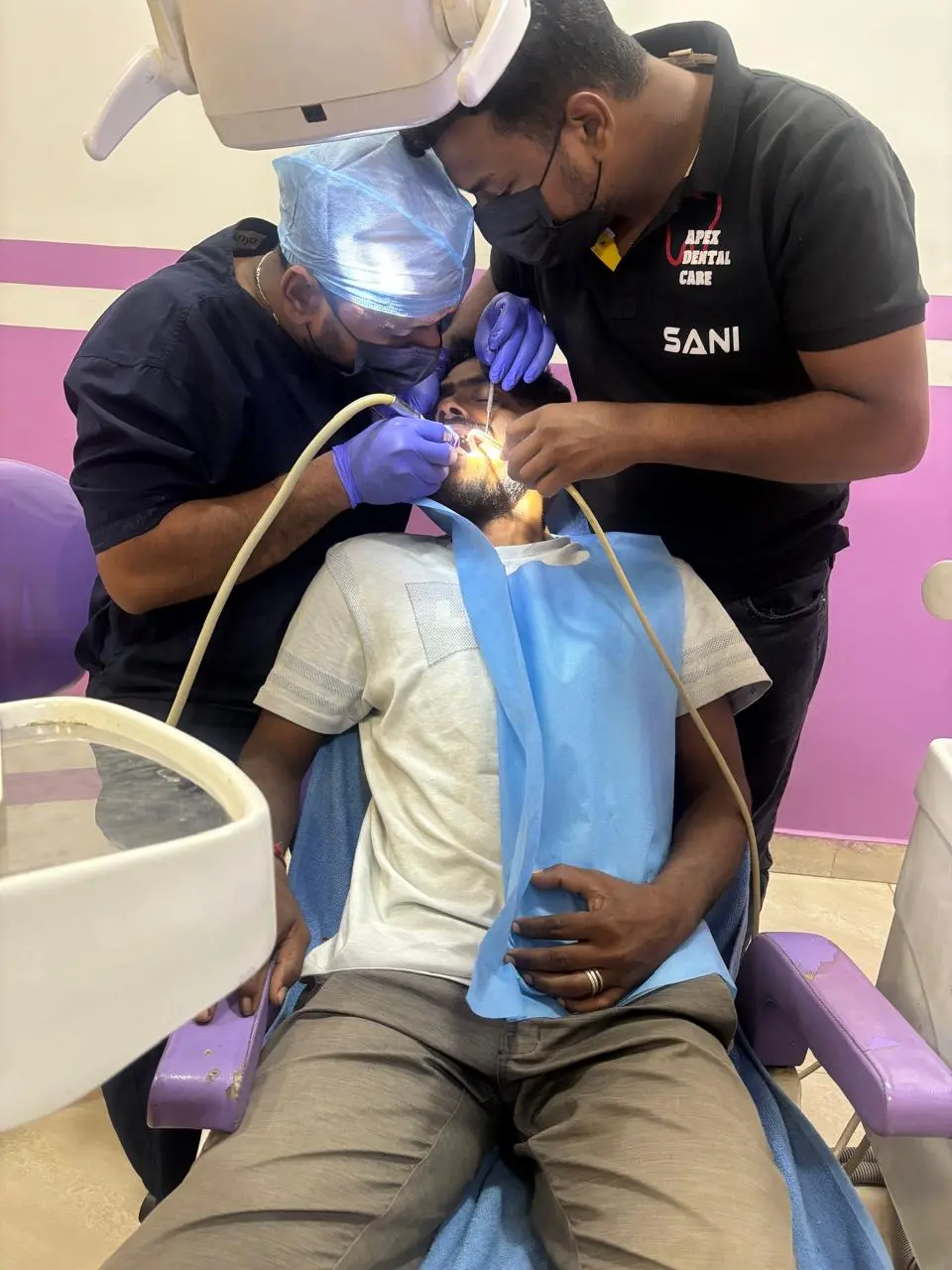 Smiling patient receiving dental treatments in Bhadrak clinic